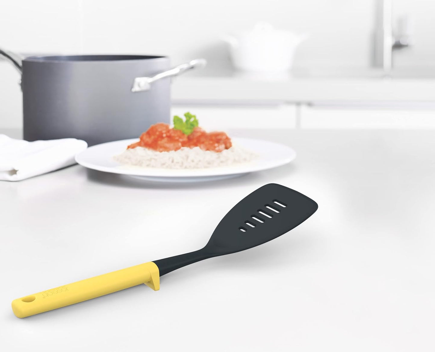 Joseph Joseph Duo Slotted Turner with Integrated Tool Rest: Hygienic, Heat-Resistant Nylon Head, Safe for Non-Stick Cookware, Light Yellow