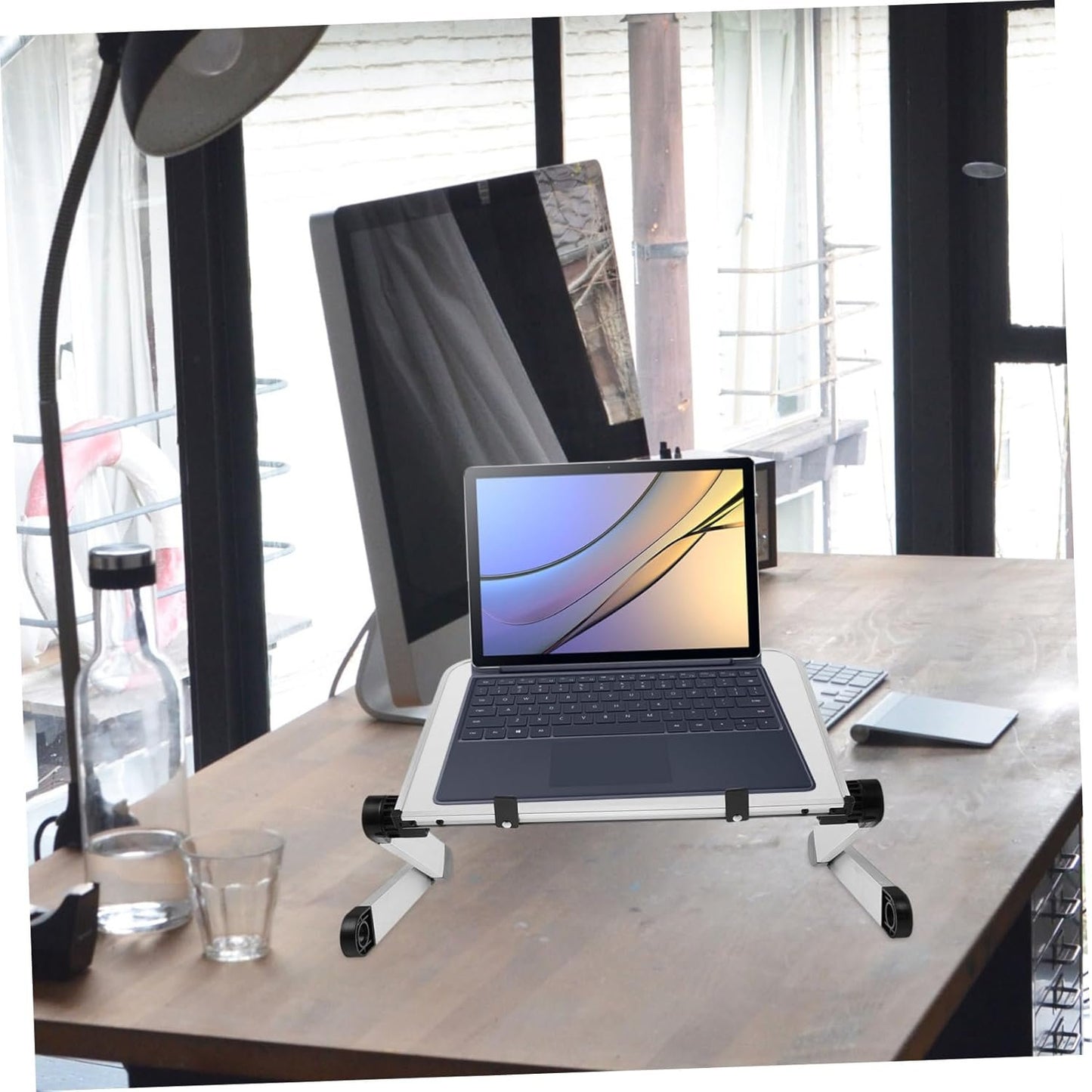 COMNESTBI Adjustable Laptop Stand for Desk Ergonomic Riser Heat Dissipation Space-Saving Design for Laptops and Tablets for Use Enhanced Workspace Organization